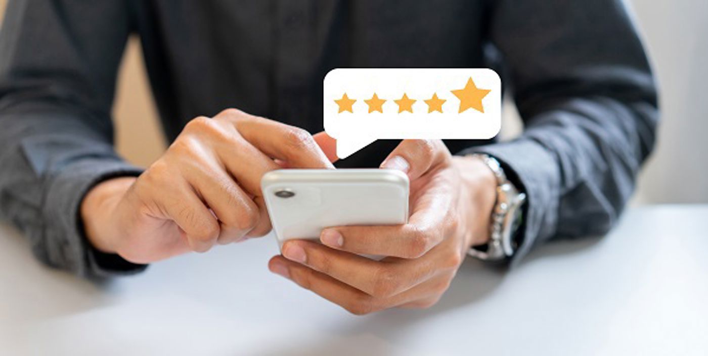 man-hand-press-smartphone-screen-with-gold-five-star-rating-feedback.jpg